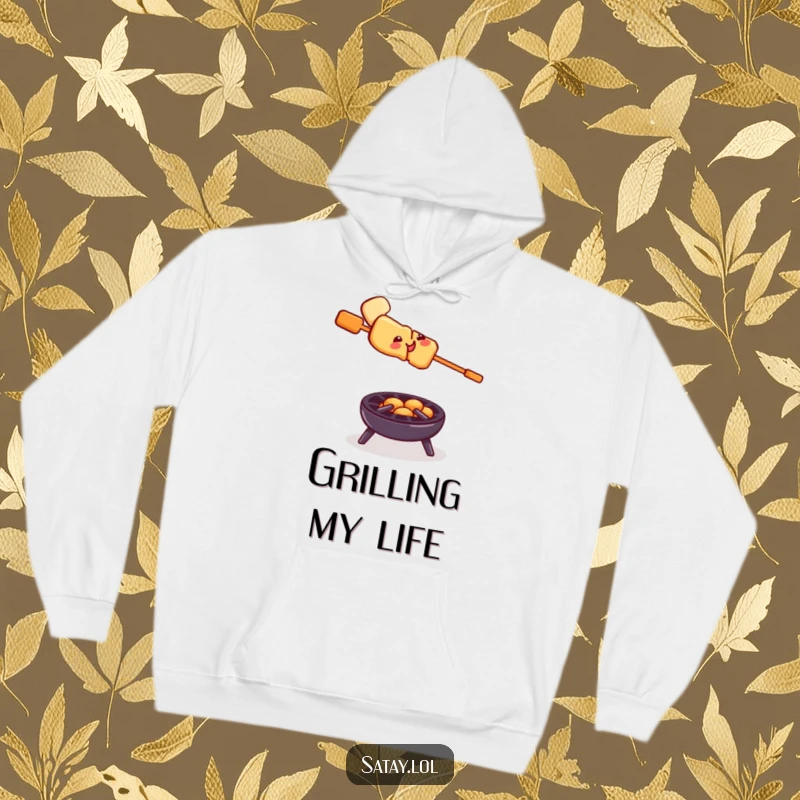 Funny satay skewer grill hoodie, a smiling skewer balancing precariously on a tiny grill, cozy apparel for the adventurous.