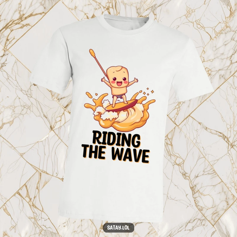 Funny satay skewer character joyfully surfing a breaking wave made of rich peanut sauce, featured on a t-shirt.